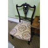 A FIRST QUARTER 20TH CENTURY FANCY SHAPED LOW SEATED NURSING STYLE CHAIR with upholstered seat pad