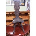 A CARVED OAK SPINNING CHAIR