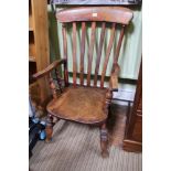 A 19TH CENTURY STICK BACK COUNTRY KITCHEN ARMCHAIR with solid seat