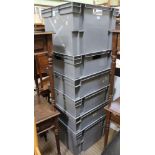 A SET OF SIX GREY MOULDED PLASTIC STACKING CRATES