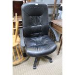 A BLACK LEATHER FINISHED EXECUTIVE TYPE ARMCHAIR
