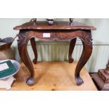 A SMALL MAHOGANY FINISHED HARDWOOD SQUARE TOPPED TABLE on carved legs