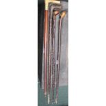 FOUR VARIOUS WALKING STICKS