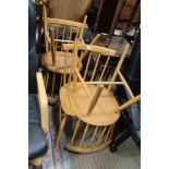 A SET OF FOUR ERCOLL STYLE SPINDLE BACK SOLID SEATED CHAIRS