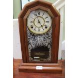 A PROBABLE AMERICAN OAK CASED MANTLE CLOCK with bell chime