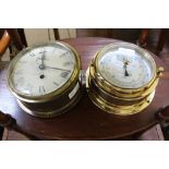 TWO BRASS SHIPS PORTHOLE STYLE DECORATIVE ITEMS one a clock the other a barometer