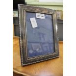 A HALLMARKED SILVER PHOTO FRAME