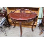 A PAINTED FANCY DEMILUNE THREE LEGGED TABLE