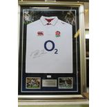 A MARTIN JOHNSON AUTOGRAPHED ENGLAND RUGBY SHIRT from the 2003 World Cup winner, in presentation