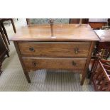 AN OAK TWO DRAWER CHEST