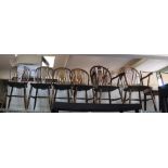 A SET OF MODERN WHEEL & STICK BACK DINING CHAIRS four singles & two carvers