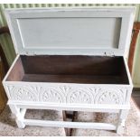 A LATER PAINTED PROBABLE OAK BOX TOP STOOL, with carved frontage