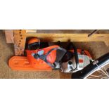 A STIHL BRANDED PETROL DRIVEN CHAINSAW, 820AV Wood Boss, together with ear defenders and