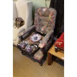 A MODERN FLORAL UPHOLSTERED DEEP SEATED BUTTON BACKED VICTORIAN ARMCHAIR