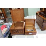 A CARVED OAK BOX, decorated with acorns, together with a small wooden box, containing a coin