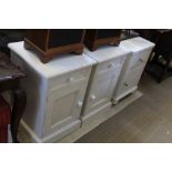A PAIR OF LATER PAINTED BEDSIDE UNITS together with another similar