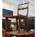 A REGENCY MAHOGANY FINISHED SINGLE CHAIR having Nelsons Victory ropework crest rail over bullseye