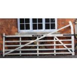 A LARGE WHITE PAINTED FIVE BAR GATE bearing the name plaque 'Avon House'