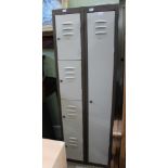 A FREESTANDING TWO SECTIONAL SET OF METAL STORAGE LOCKERS one full height, the other quartered
