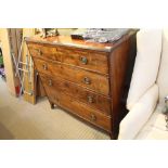 A LATE 19TH CENTURY MAHOGANY FINISHED CHEST OF FOUR GRADUATING DRAWERS, on splayed feet