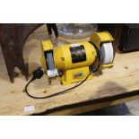 A SMALL YELLOW FINISHED ELECTRONIC BENCH GRINDER