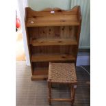A SMALL PINE SET OF OPEN FRONTED SHELVES, together with a strung top stool