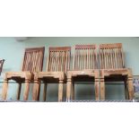 A SET OF FOUR IMPORTED WOOD SPINDLE BACK SOLID SEATED DINING CHAIRS