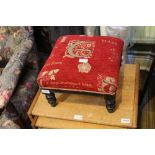 A LATE 19TH CENTURY EBONISED FRAMED SQUARE PAD TOP FOOTSTOOL recently re-upholstered
