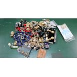 A BAG CONTAINING A VARIED SELECTION OF COSTUME JEWELLERY