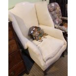 A GEORGIAN DESIGN WING BACKED ARMCHAIR all-over upholstered in old gold trellis pattern cotton,