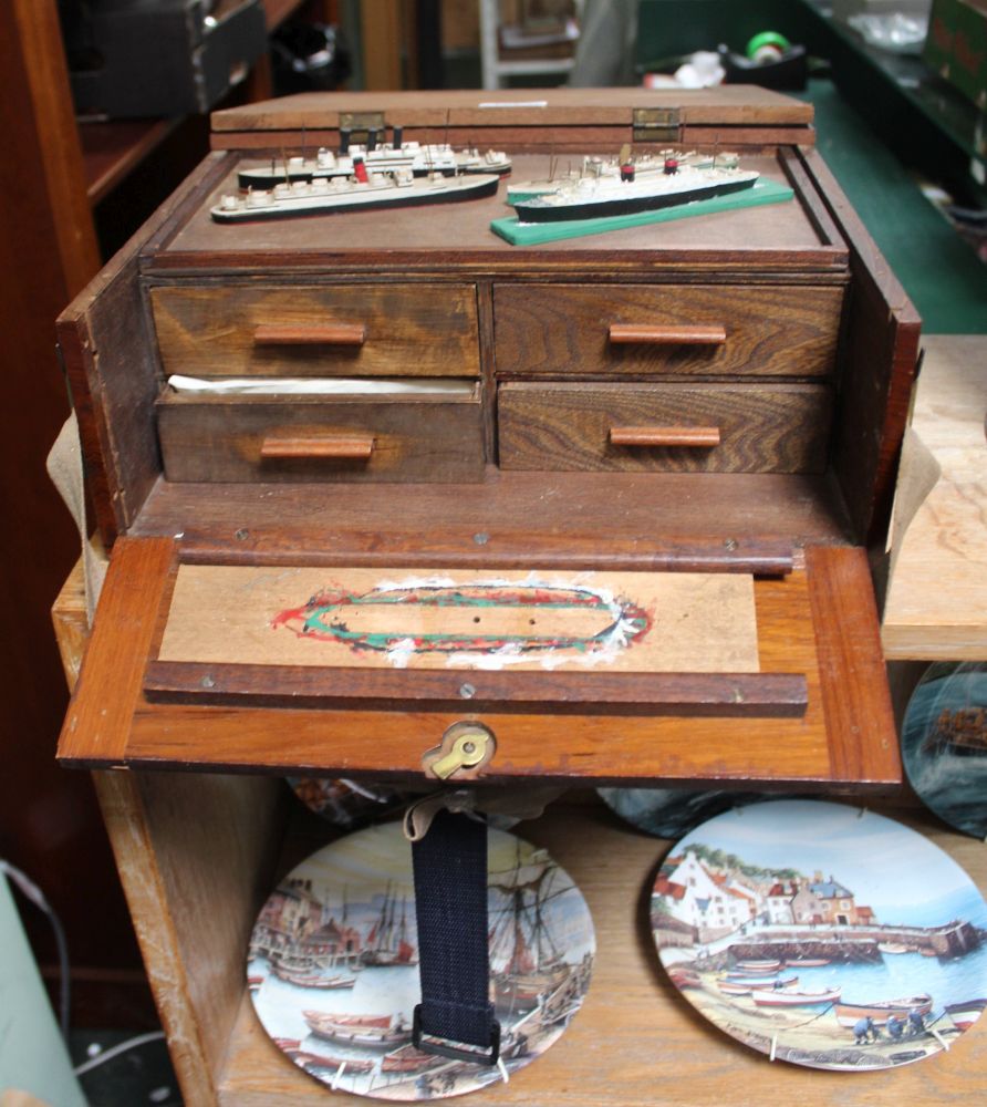 A WOODEN BOX CONTAINING MINIATURE MODEL BOATS, and model making equipment