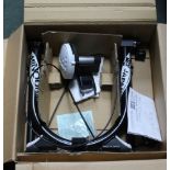 A BRAND NEW BOXED MINOURA INDOOR BICYCLE TRAINER