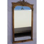 A 20TH CENTURY LARGE SIZE FANCY GILT FRAMED BEVEL PLATE MIRROR, having upper central crown crest,