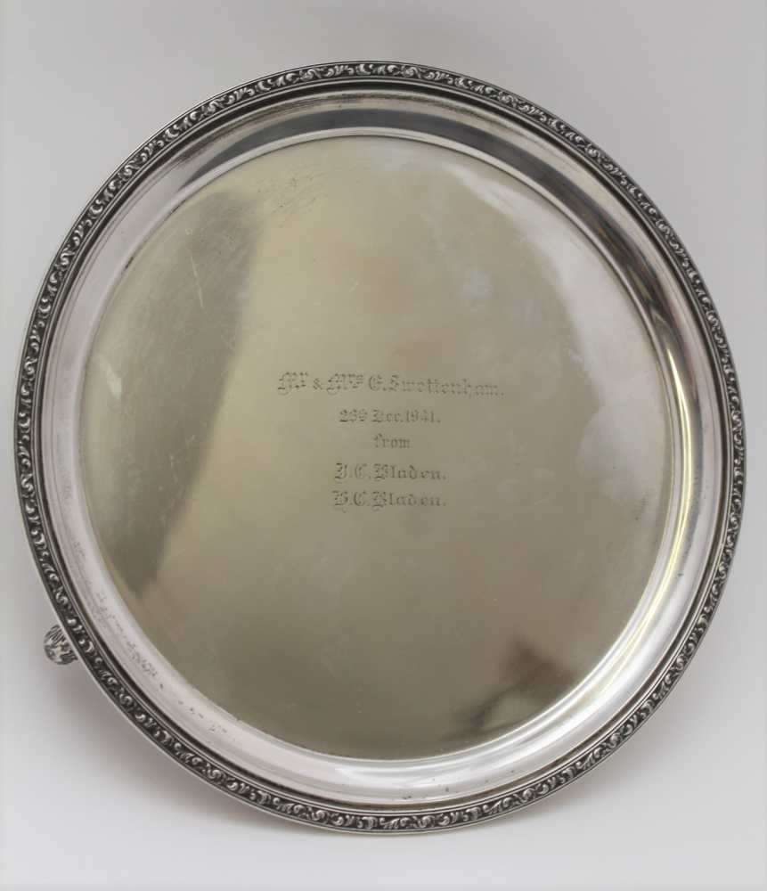 JAMES DIXON & SONS LTD., A SILVER SALVER, acanthus leaf rim, on three scroll feet, Sheffield 1939,