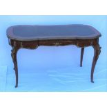 A LATE 20TH CENTURY FRENCH DESIGN KINGWOOD WRITING TABLE, with skiver insert top, and moulded