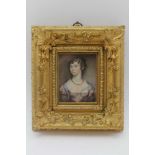 AN EARLY 19TH CENTURY MINIATURE PORTRAIT WATERCOLOUR PAINTING, a young woman, her in ringlets, 8cm x