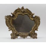 A 19TH CENTURY OR EARLIER VENETIAN GILDED CARVED WOOD MIRROR, acanthus scroll frame, with easel