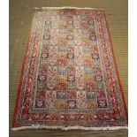 A WOVEN WOOLLEN FLOOR CARPET the central field being floral compartments within floral & animal