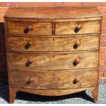 A 19TH CENTURY MAHOGANY FINISHED BOW FRONTED CHEST having two inline drawers, three further