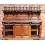 A LATE 19TH CENTURY OAK BUFFET STYLE SIDEBOARD, having decorative baluster gallery upright, with