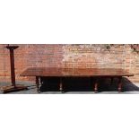 A LARGE EXTENDING EARLY 20TH CENTURY MAHOGANY RECTANGULAR FORM DINING TABLE, on two halves,