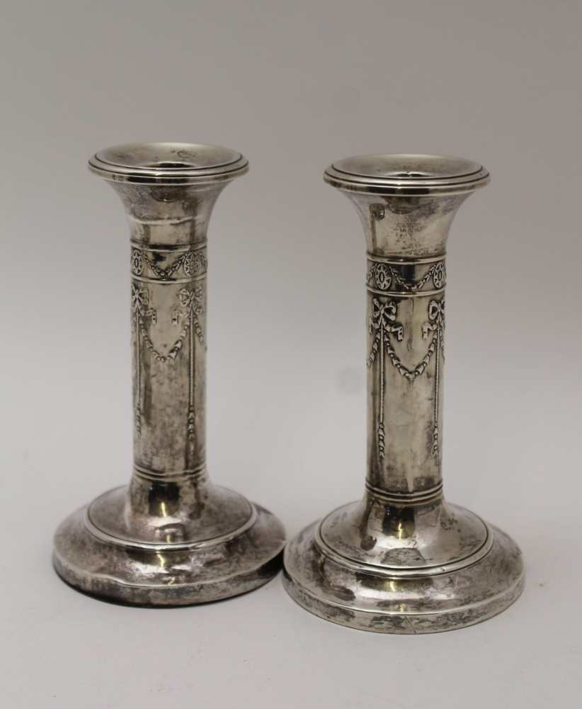 A PAIR OF EDWARDIAN SILVER CANDLESTICKS, embossed ribbon and bell husk swags on circular bases, - Image 2 of 9