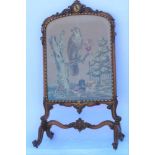 A 19TH CENTURY FANCY WALNUT FRAMED TAPESTRY FIRE SCREEN, having carved crest rail with carved insert