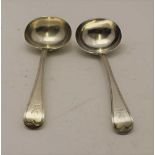 GEORGE ALDWINCKLE A pair of late 19th century silver sauce ladles, engraved with a spread eagle