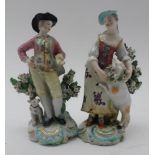 A PAIR OF DERBY PATCH MARK FIGURES The Garland Shepherds, he wears a broad brimmed hat, pink jacket,