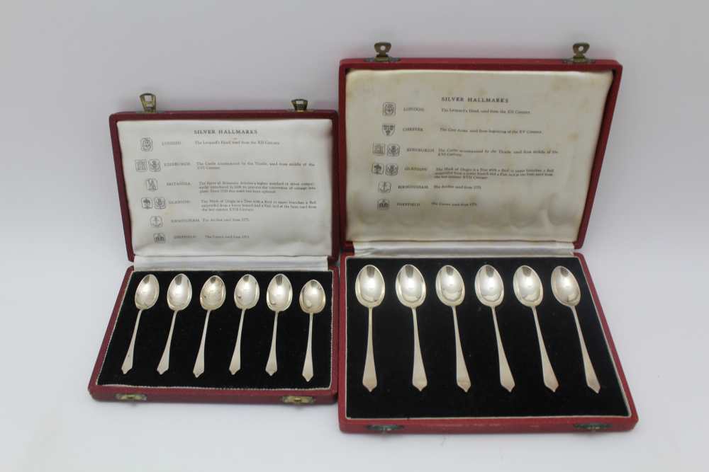 A CASE OF SILVER TEASPOONS & a case of silver coffee spoons, each with a different assay mark in