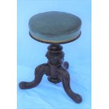 A VICTORIAN MAHOGANY REVOLVING PIANO STOOL, grey fabric upholstered, circular seat on carved