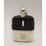 AN EDWARDIAN SILVER MOUNTED HIP FLASK, silver screw cap and removable cup, crocodile covered