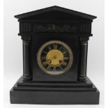 A LATE VICTORIAN BLACK SLATE MANTEL CLOCK of Architectural classical form, with embossed frieze