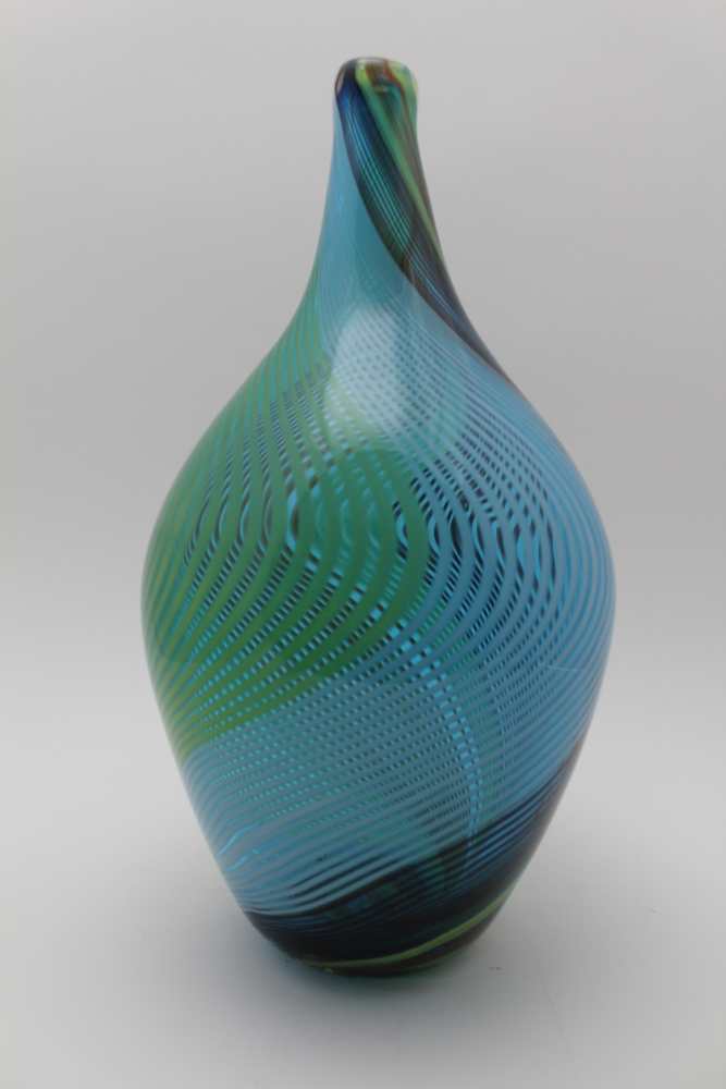 A MURANO GLASS VASE, spiral decoration in colours to the flask form body, in the manner of Dino